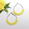 Handmade yellow crochet hoop earrings